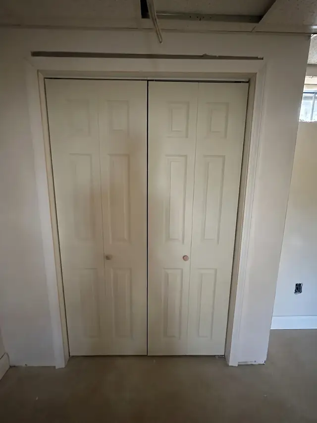 Closet doors and casing in a finished basement in Chelmsford, MA
