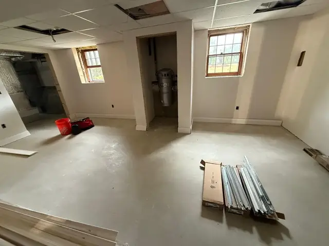Basement drywall complete before flooring installation