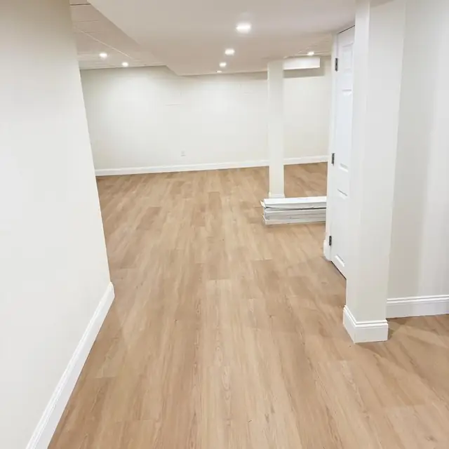 Basement with new flooring and trim ready for final touches