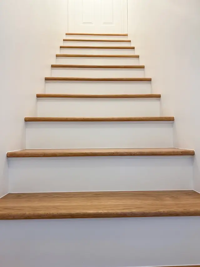 New basement stairs with wood treads and white risers in Ashland, MA