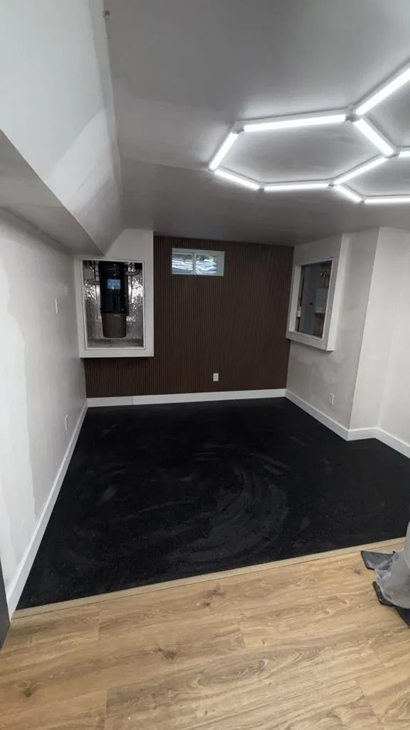 Basement Home Gym by Innov Builders in Beverly, MA