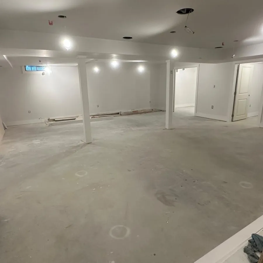 Drywall and Paint: basement drywalled and painted with recessed lights, ready for flooring, Innov Builders project in North Andover, MA